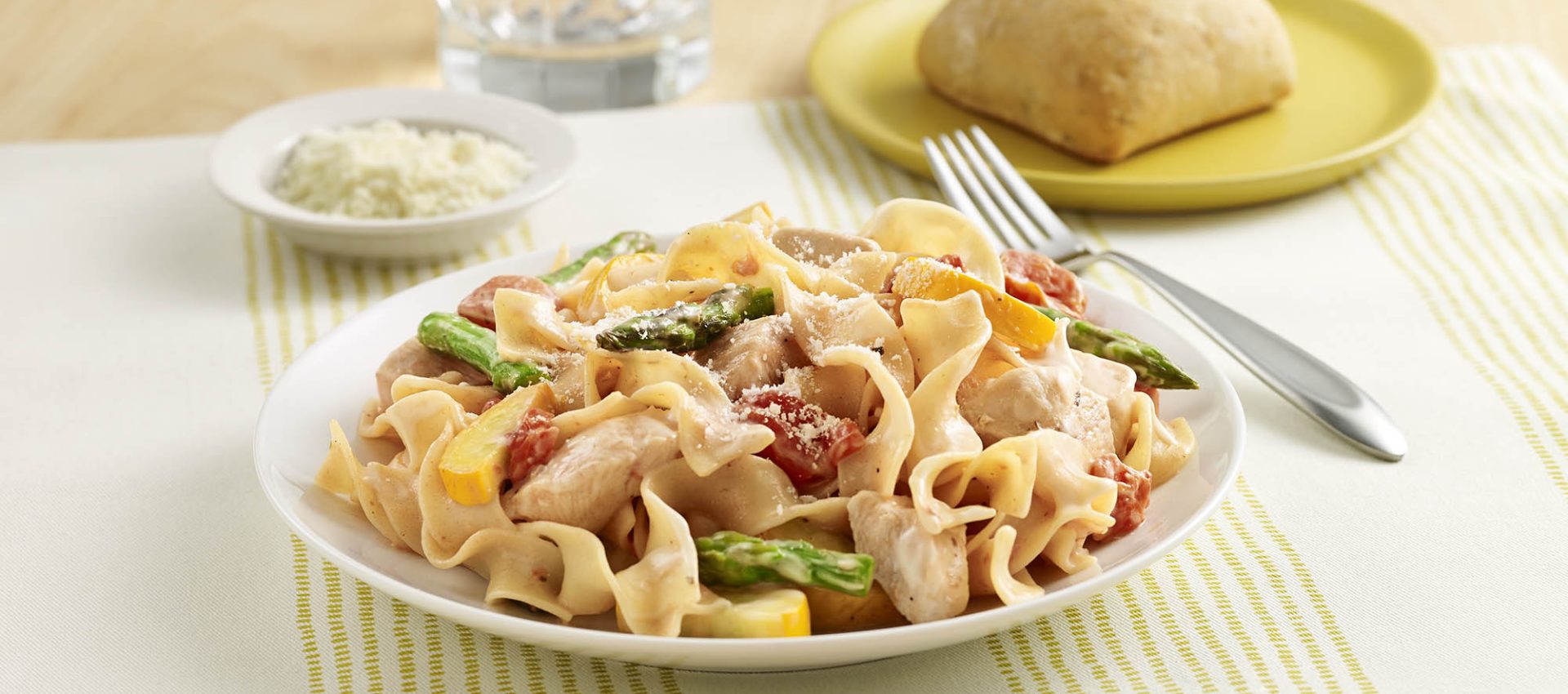 Chicken Noodle Primavera An egg noodle recipe with chicken, fresh vegetables, seasoned tomatoes and Alfredo sauce.
