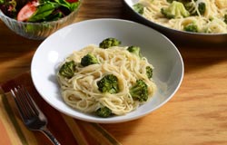 Angel hair and broccoli in a light sauce, topped with Parmesan
