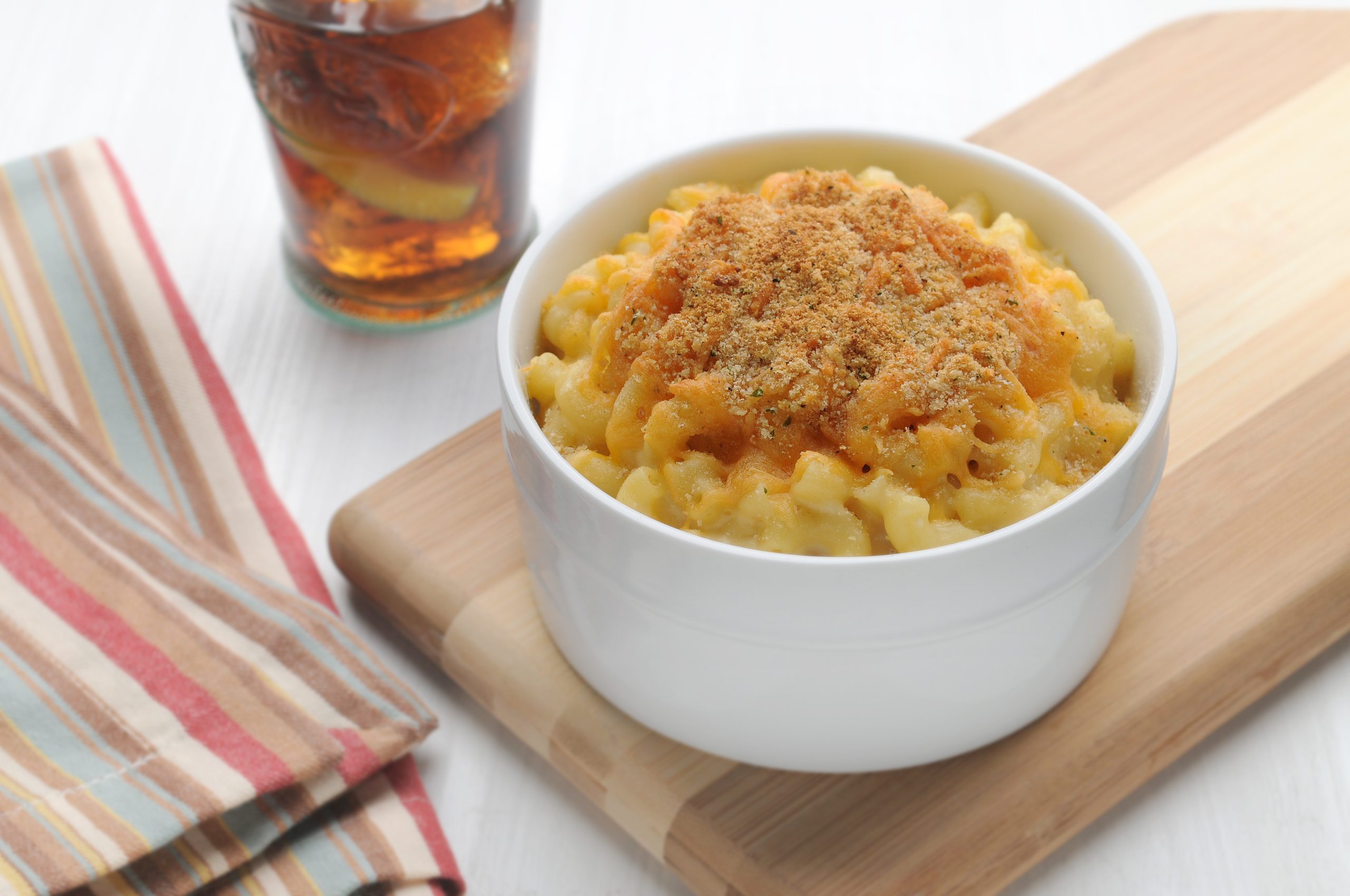 Cheddar and Swiss Macaroni and Cheese, topped with bread crumbs in a ramekin